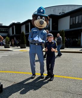 One of the little chiefs posing with the Washington State Patrol Bear