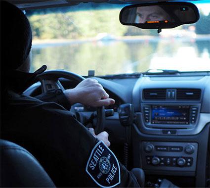 police officer driving a car